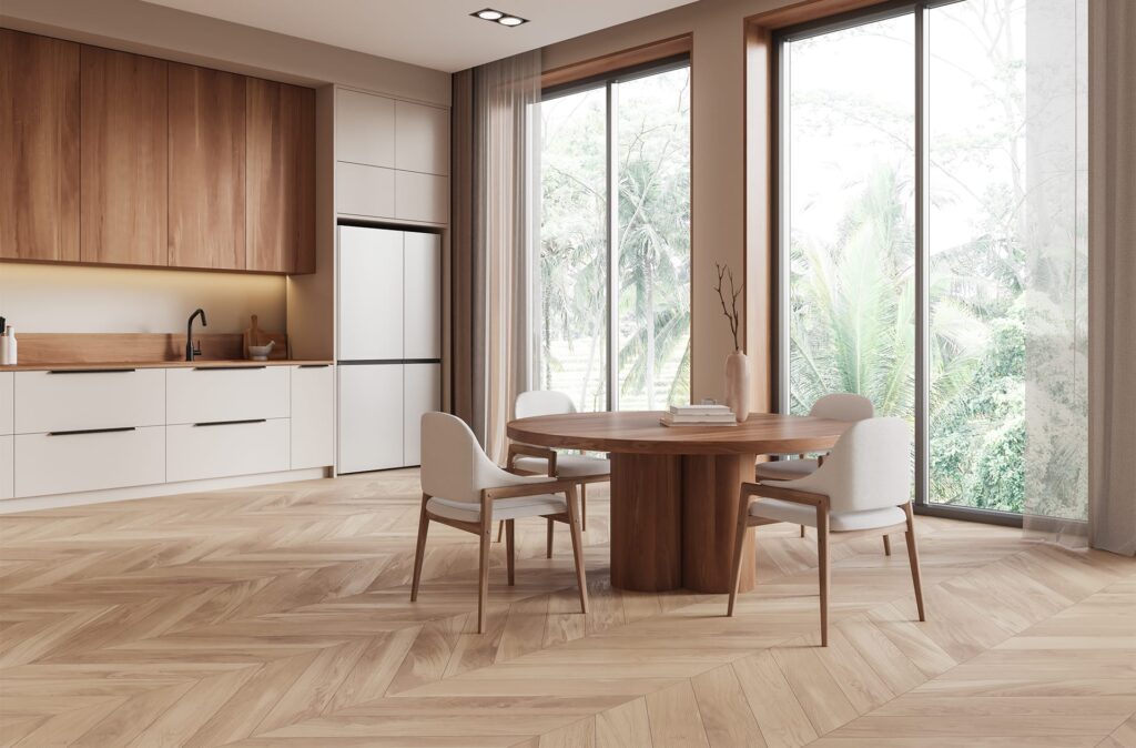 kitchen and dining space with wood accents, light chevron flooring