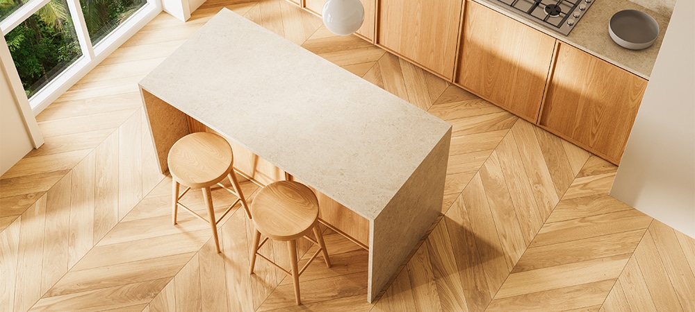 kitchen with natural wood cabinets, light countertops, and chevron wood flooring