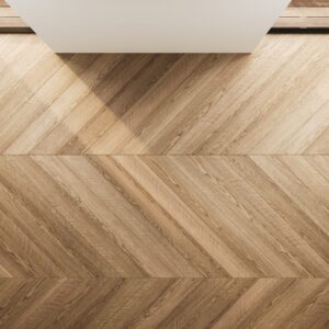 top view of an empty interior with chevron wood flooring, soft lighting, and minimal deco