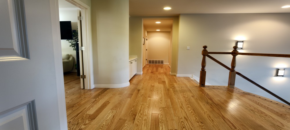 Newly installed red oak floor boards for hallway in home