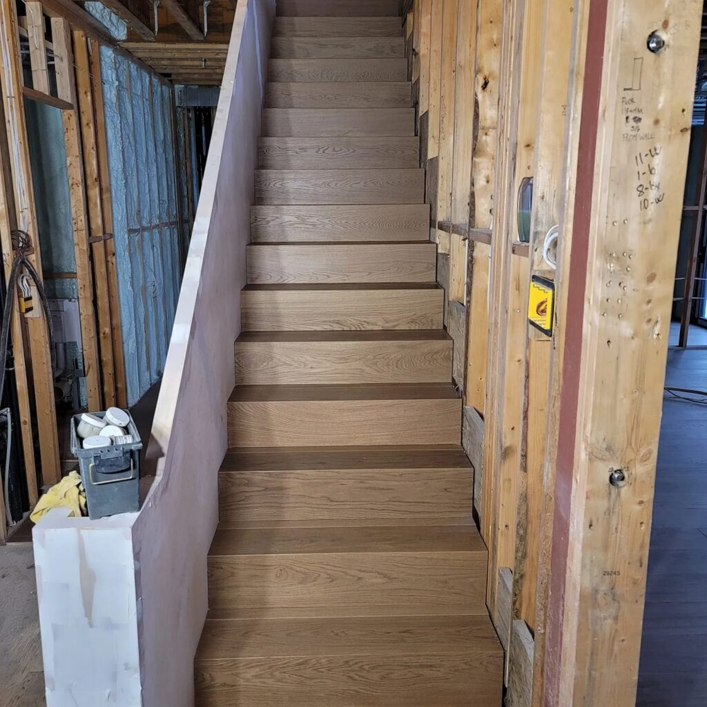 Professional hardwood stair refinishing in progress — LV Hardwood Flooring Toronto